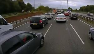 Car clips HGV while changing lanes